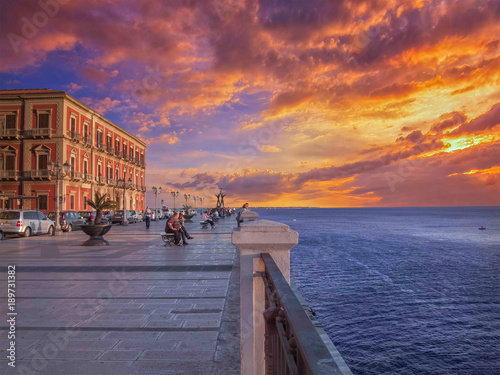 Taranto, Corso due mari con le isole Cheradi sullo sfondo - panorama al tramonto photo