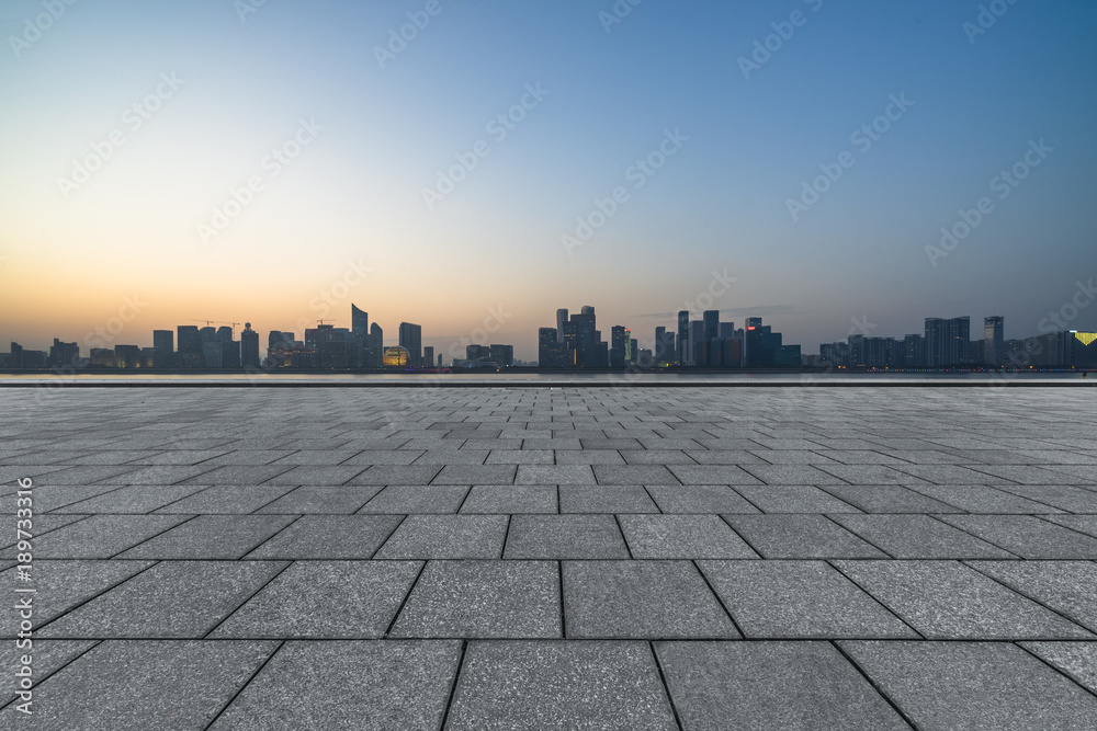 Panoramic skyline and buildings with empty square floor.