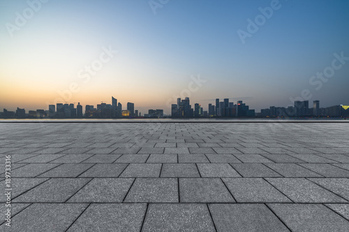 Panoramic skyline and buildings with empty square floor. © hallojulie