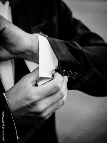 Posed groom with button hole.Wedding details, beautiful boutonniere
