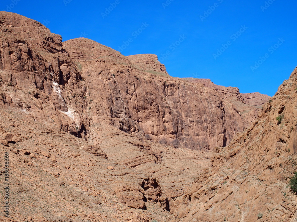 Rocky slope of TODGHA GORGE canyon landscape in MOROCCO, eastern part of High Atlas Mountains range at Dades Rivers