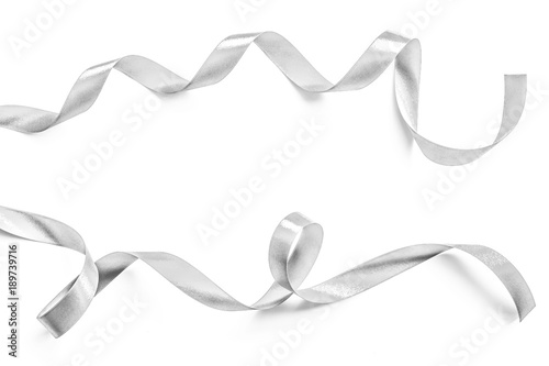 Silver ribbon bow in bright silver white grey color isolated on white background with clipping path for holiday and party greeting card design decoration element © Chinnapong