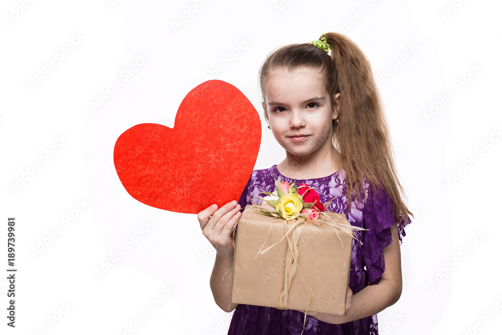 Beautiful caucasian girl in purple lace dress holding a box with a gift decorated with flowers. Shooting in studio on isolated white background
