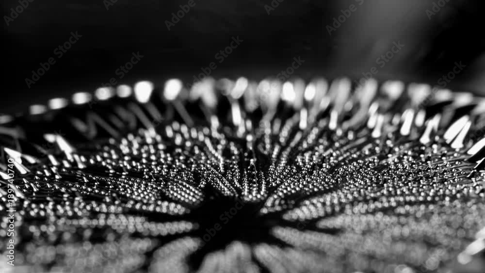 Ferrofluid under the influence of a magnetic field. Abstract background.