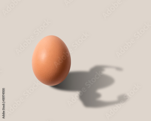 Obraz na plátně The egg casts a shadow in the form of a bodybuilder
