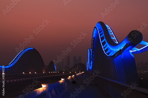 Photography meydan bridge with dubai downtown city skyline as background