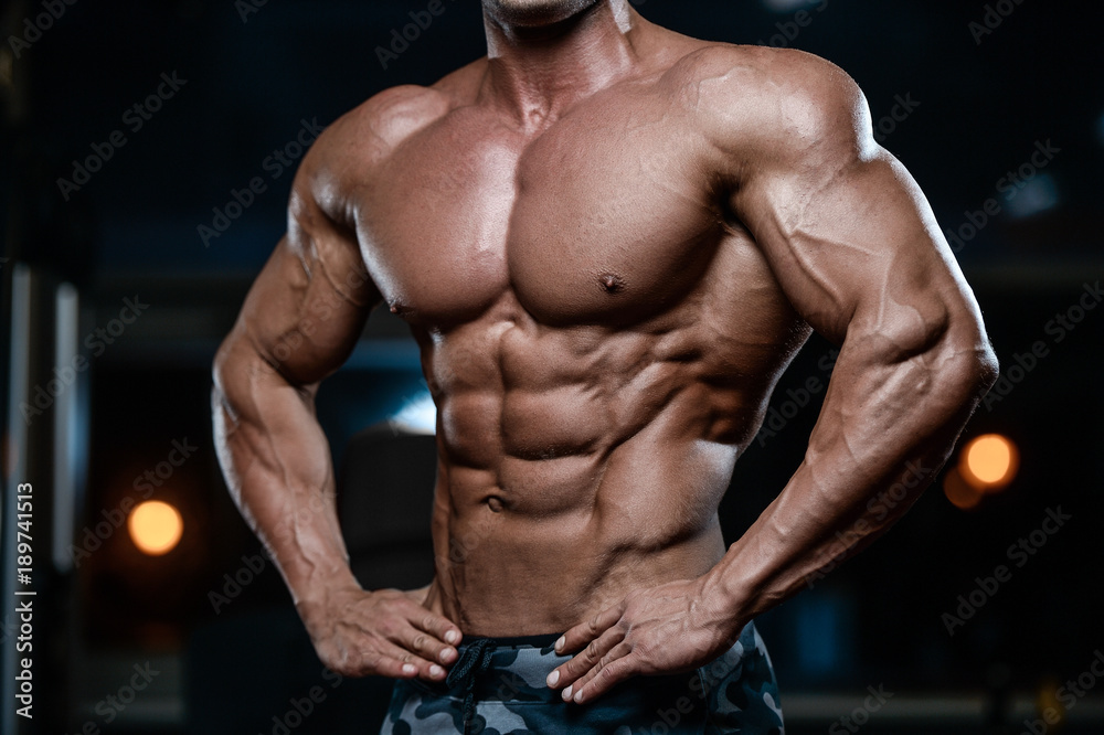 Muscular Bodybuilder Guy Doing Exercises With Gifts Stock Photo