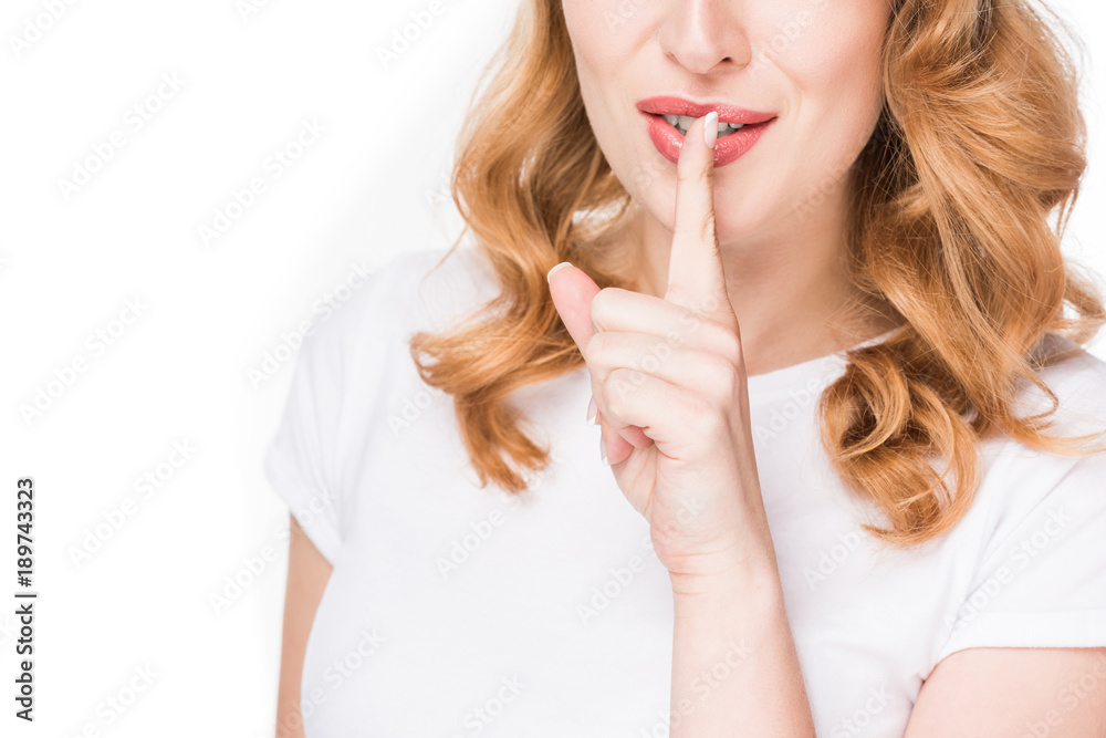 cropped shot of woman showing silence sign isolated on white cropped shot of woman showing silence sign isolated on white
