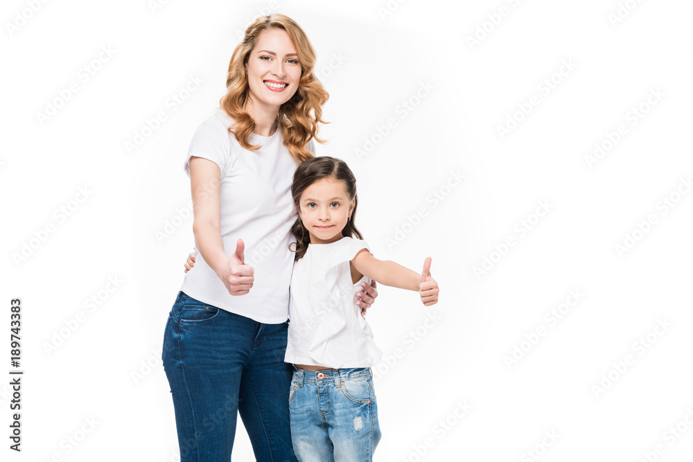 portrait of smiling mother and daughter showing thumbs up isolated on white portrait of smiling mother and daughter showing thumbs up isolated on white
