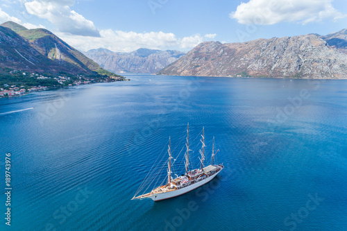 Aerial view of the big white Sailing Ship in the Bokaktorsky Bay. Montenegro.