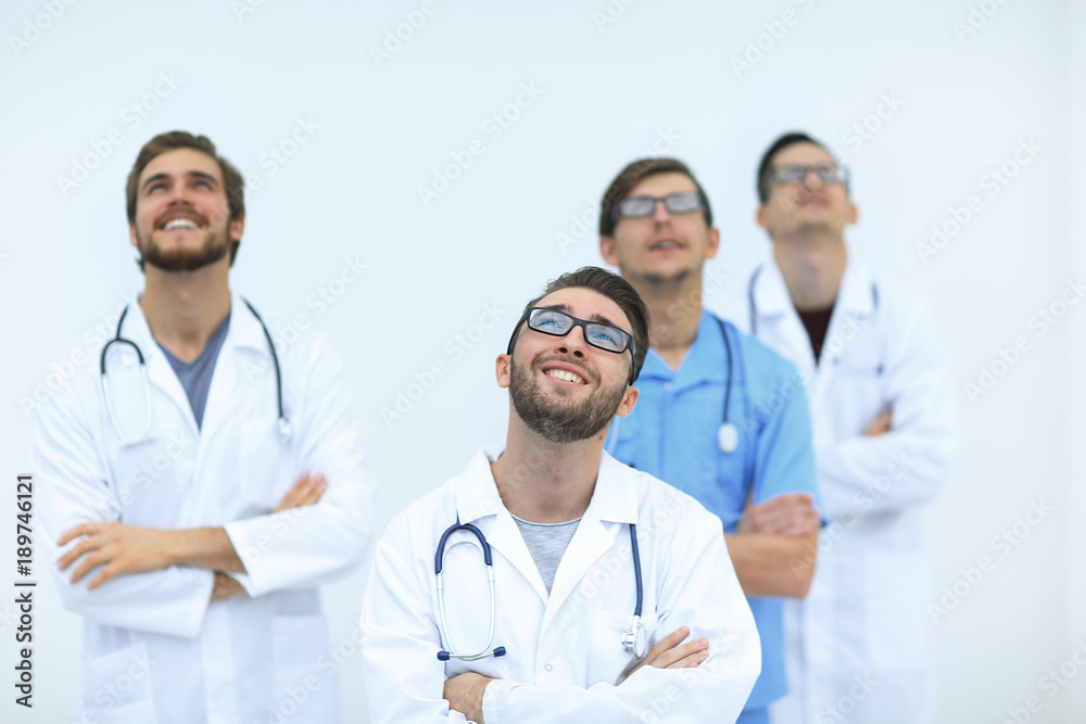 confident medical team looking up.isolated on white