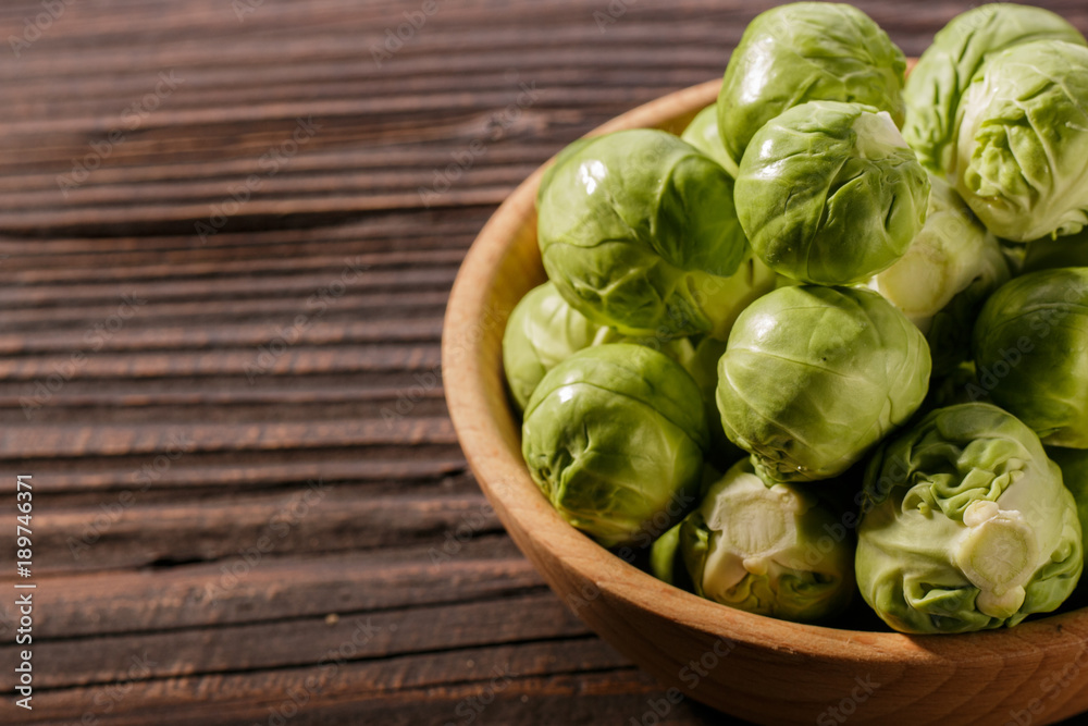 Brussels sprouts on a rustic wooden background