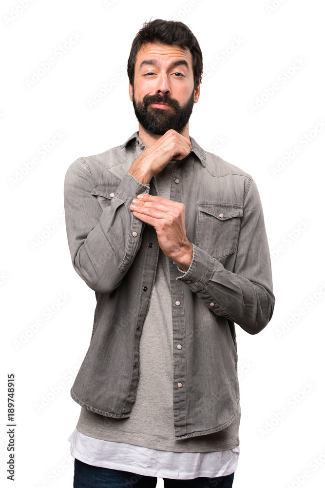 Fototapeta premium Handsome man with beard proud of himself on white background