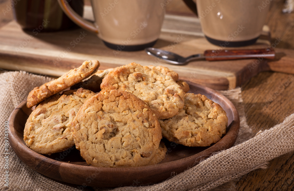 Pile of Peanut Butter Cookies on a Wooden Plate