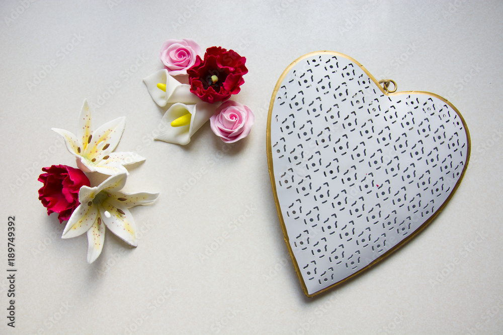 Fototapeta premium Colorful flowers with sugar and big heart