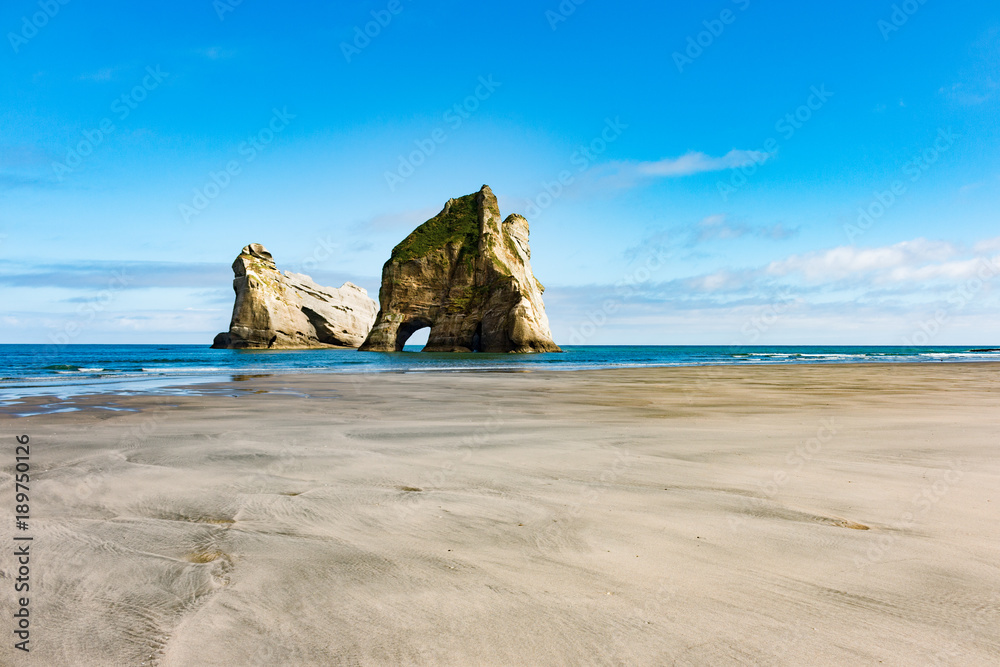 New Zealand wharariki beach and arch island rock formations