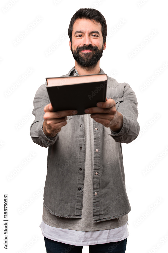 Handsome man with beard reading a book on white background Handsome man with beard reading a book on white background