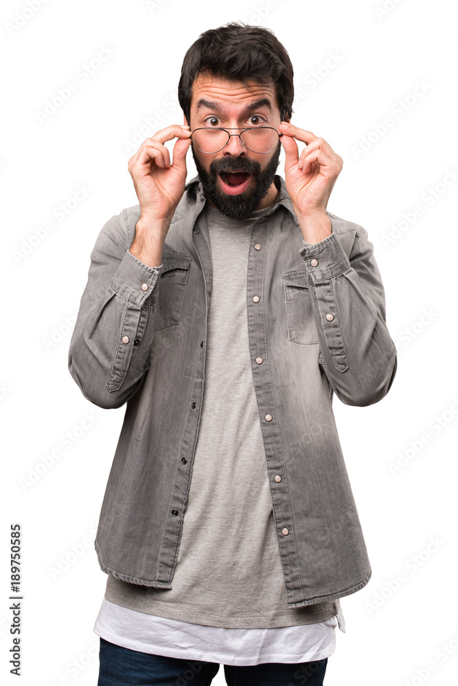 Surprised Handsome man with beard and with glasses on white background Surprised Handsome man with beard and with glasses on white background