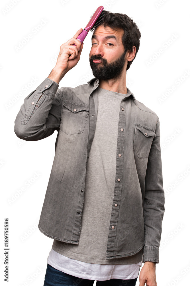 Handsome man with beard and with hair comb on white background Handsome man with beard and with hair comb on white background