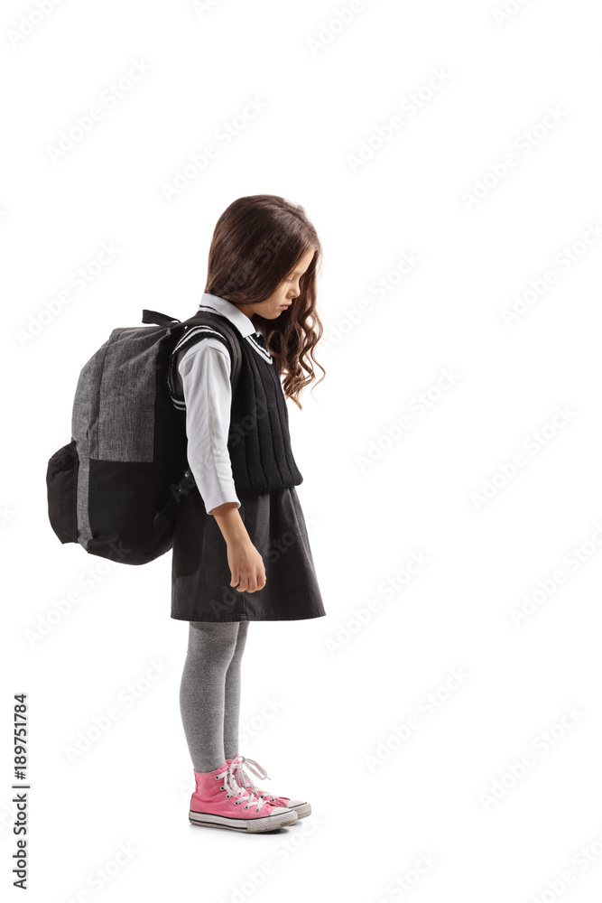 Sad little schoolgirl with a backpack Sad little schoolgirl with a backpack