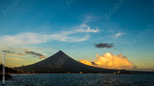 Silhouette Mayon Volcano is an active stratovolcano in the province of Albay in Bicol Region, on the island of Luzon in the Philippines. Renowned as the perfect cone because of its symmetric conical photo