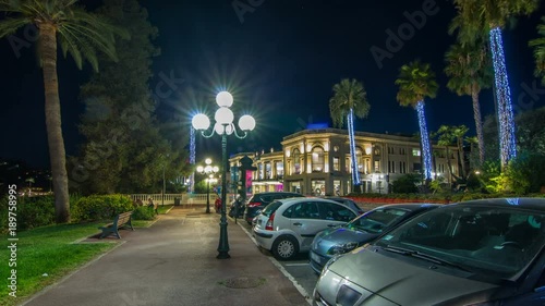 Night view to street with palms on the center of Beaulieu-sur-Mer timelapse hyperlapse. photo