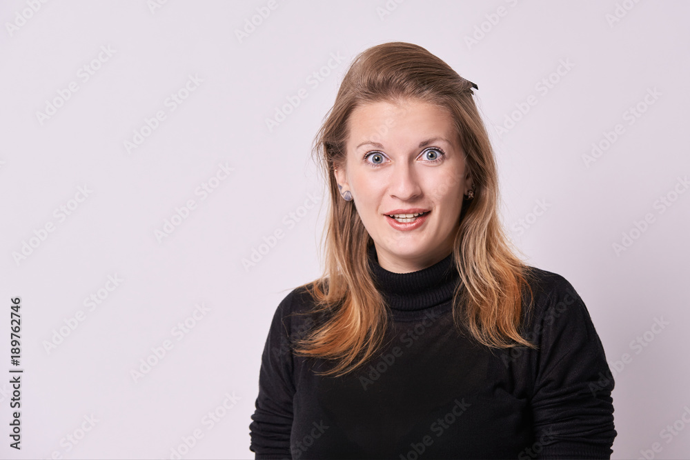 Obraz premium Young girl. Surprise expression. White background. Blonde hair