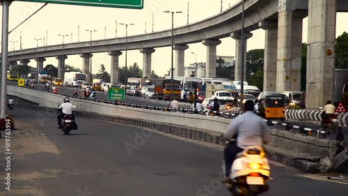Traffic on busy city, Chennai city main center heavy traffic crossing a bridge and Busy rush hour street scene at chennai, India.