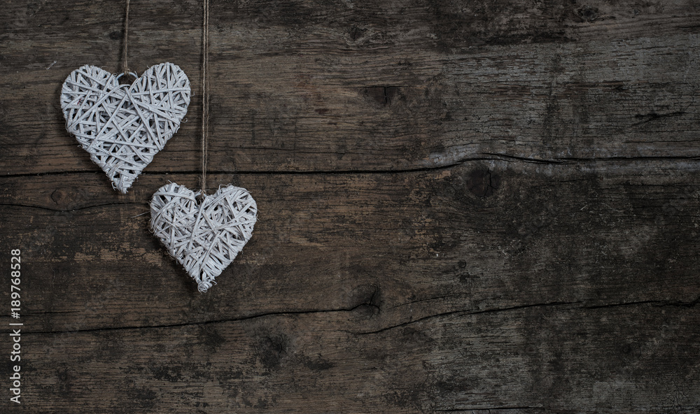 Shabby hearts on rustic wood background Shabby hearts on rustic wood background