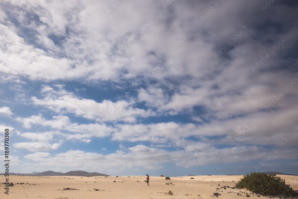 one man walk alone in the middle of nowhere