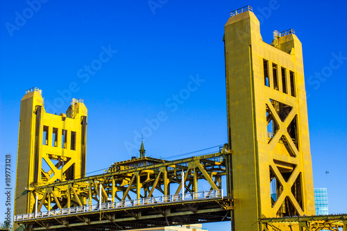 Two Golden Towers Used For Raising Bridge Over River