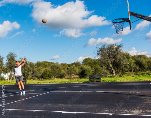 Lefty basketball player practicing jump shot