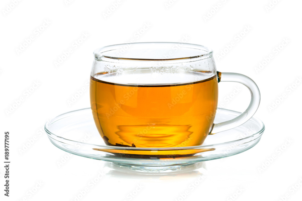 Transparent glass cup of tea isolated on a white background in close-up Transparent glass cup of tea isolated on a white background in close-up
