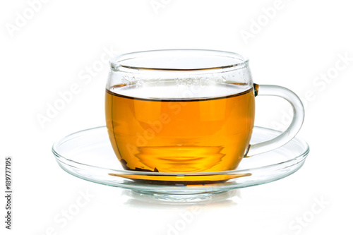 Transparent glass cup of tea isolated on a white background in close-up 