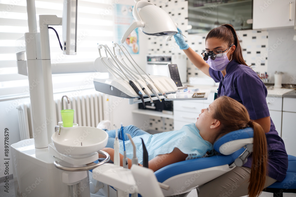 Dentist examine girl's teeth Dentist examine girl's teeth