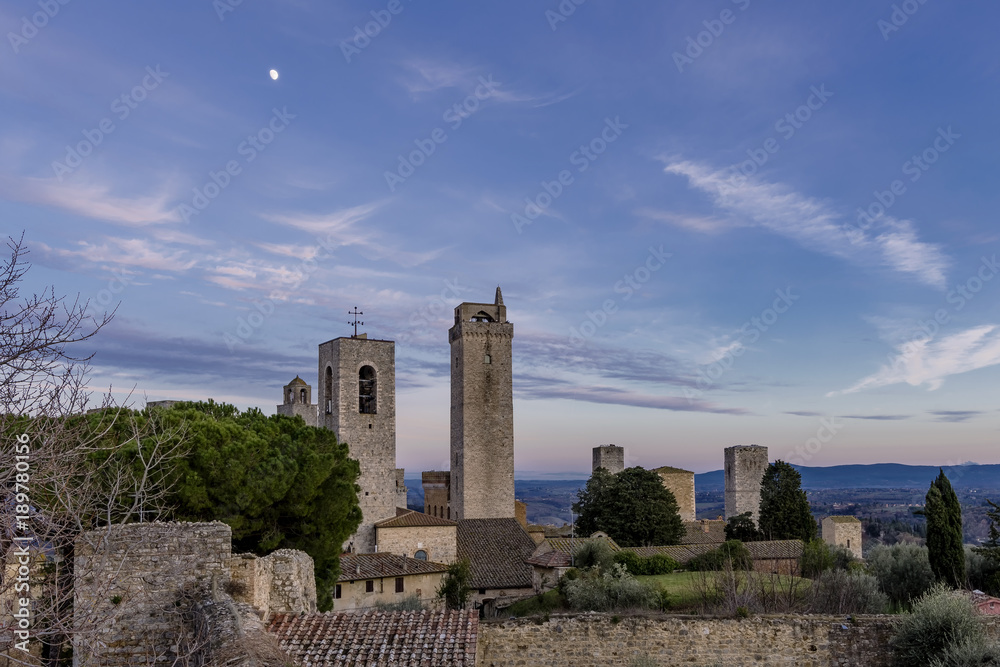 A romantic moon above the medieval center of San Gimignano, Siena, Tuscany, Italy