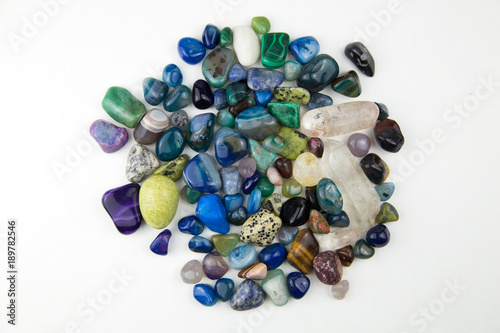 Top view of various tumbled bright coloured semi precious gemstones