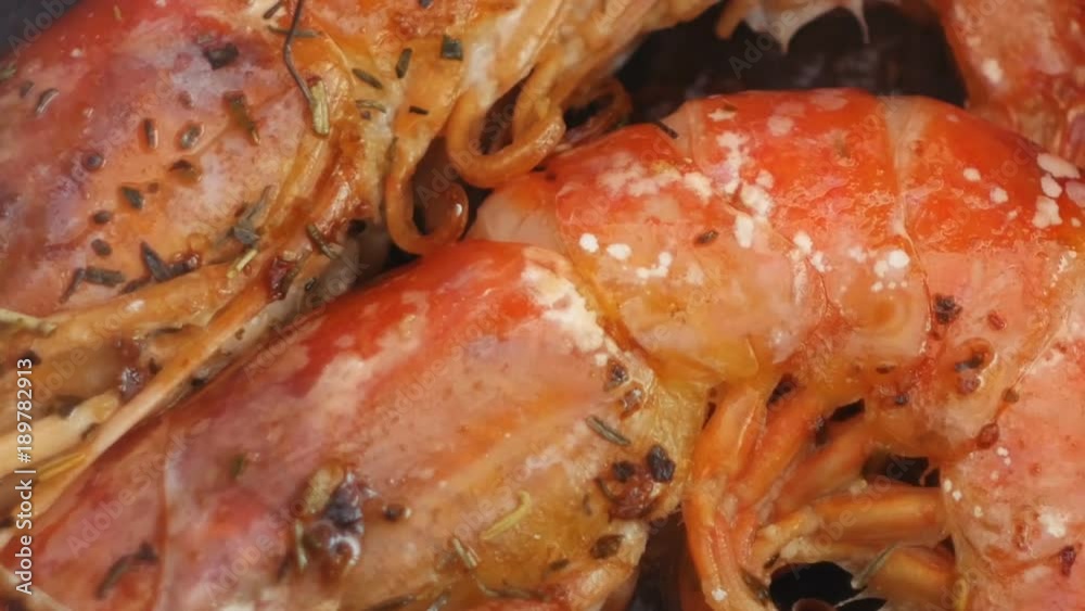 closeup large red shrimps are fried in hot oil on pan closeup large red shrimps are fried in hot oil on pan