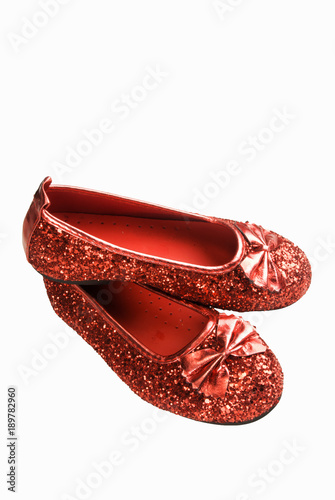 Pair of Red Glittered Shoes on a White Background