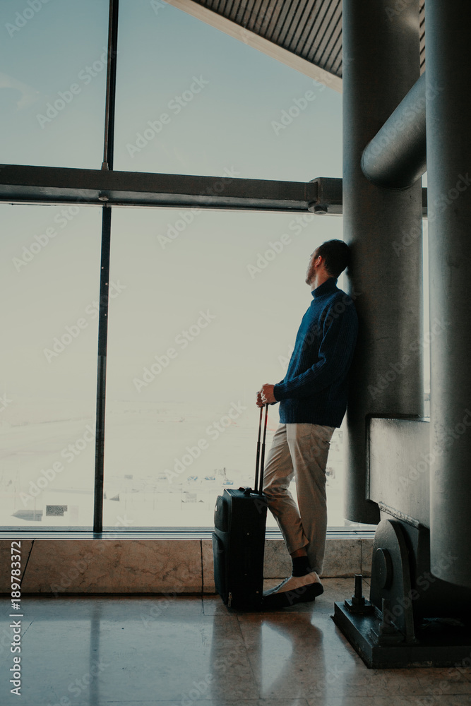 Man with suitcase at the airport