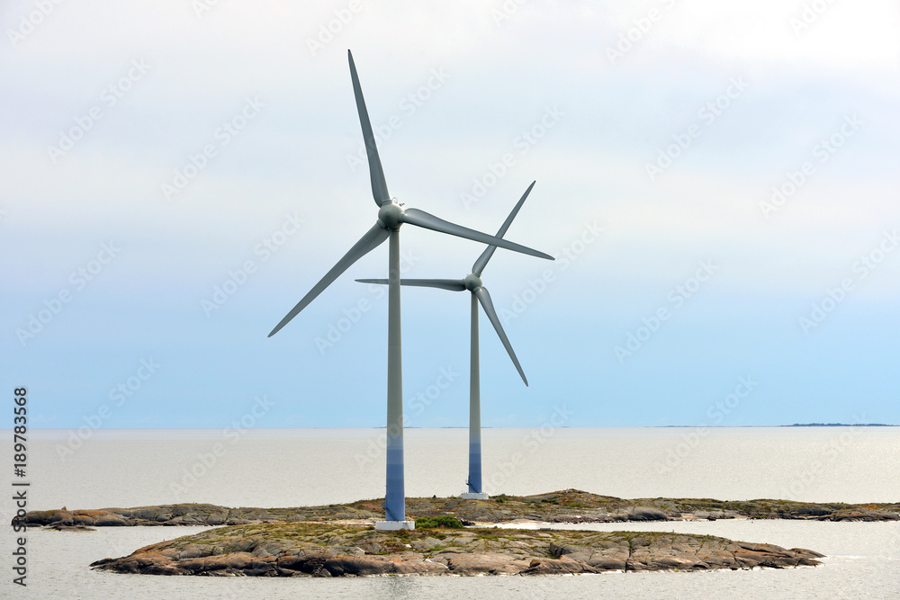 Wind Turbines on rocky shores of Aland Islands. Finland