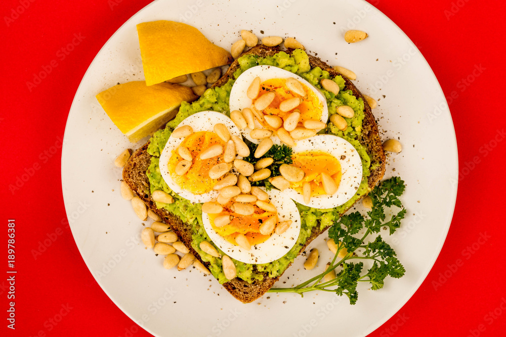 Boiled Egg on Crushed Avocado With Pine Nuts And Rye Bread Open Faced Sandwich Boiled Egg on Crushed Avocado With Pine Nuts And Rye Bread Open Faced Sandwich