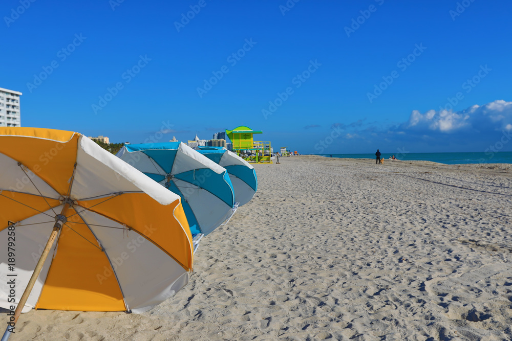 Colorful umbrellas on the beach in Miami Beach Florida.