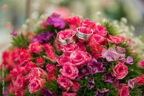 Pink wedding bouquet of flowers . Wedding bouquet with pearls and rings . Wedding bouquet made of pink Roses and rings . Selective focus. © adilcelebiyev