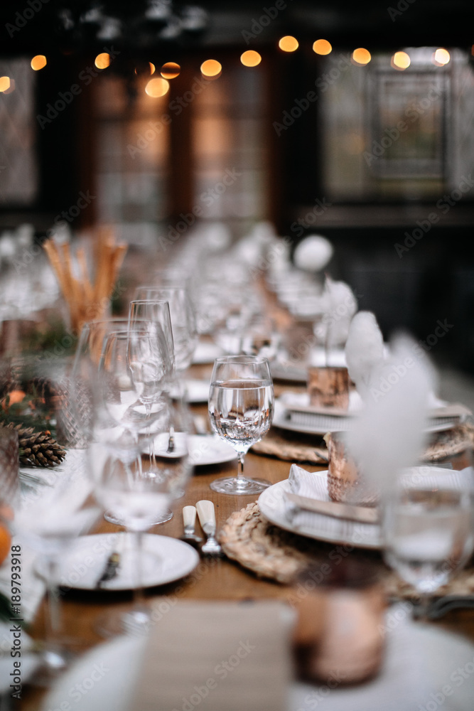 Set tables for fancy dinner in a green house Set tables for fancy dinner in a green house