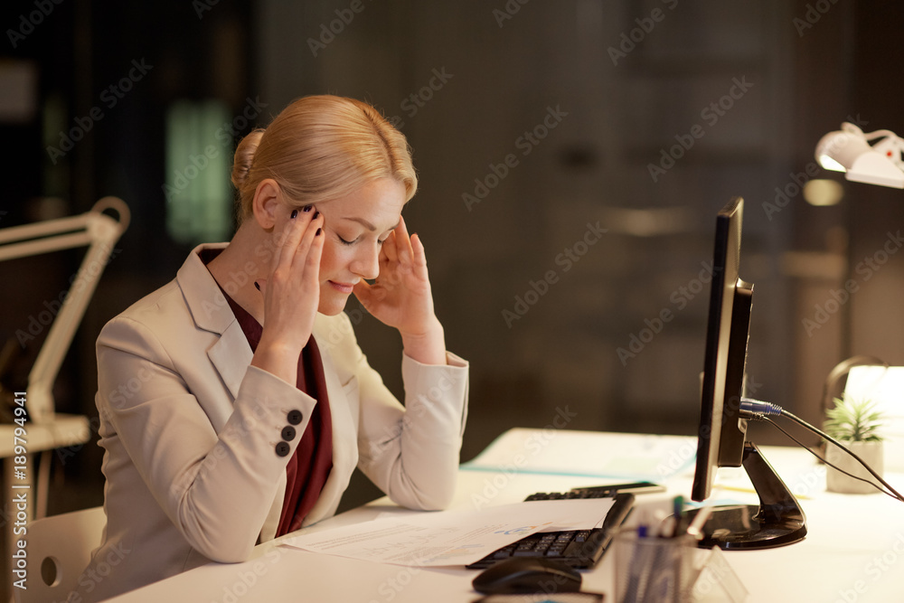 businesswoman with computer at night office businesswoman with computer at night office