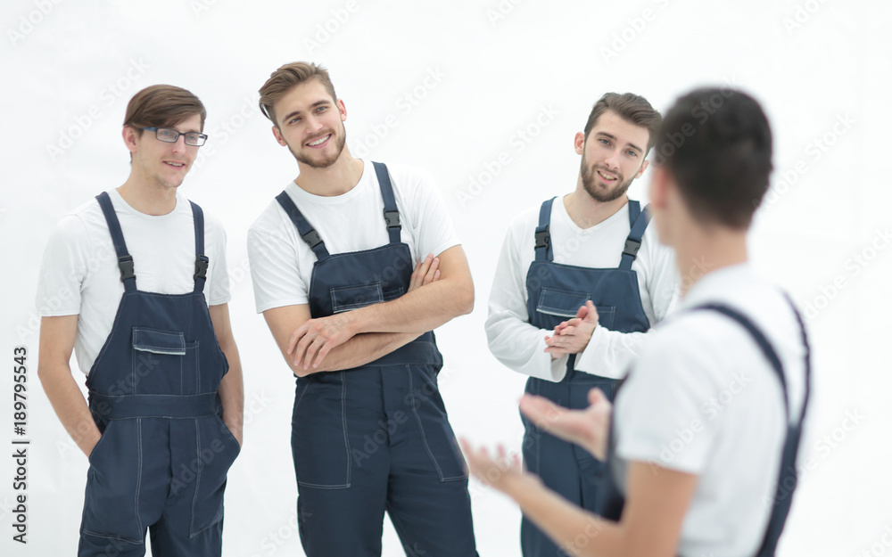 cheerful team of responsible movers and their smiling leader. cheerful team of responsible movers and their smiling leader.