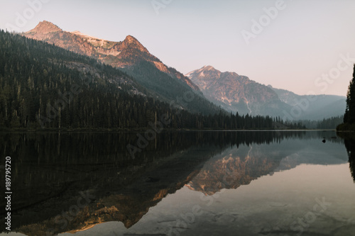 reflecting mountain lake at sunrise