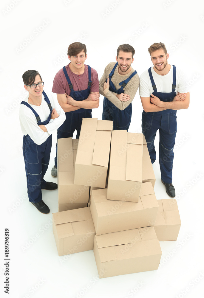 Happy smiling movers carrying boxes, isolated on white backgroun Happy smiling movers carrying boxes, isolated on white backgroun