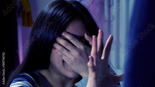 Woman at night scared of man domestic violence